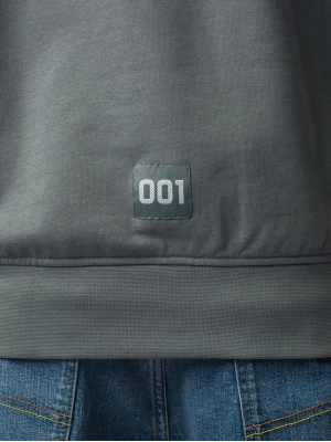 Свитшот зеленого цвета с надписью и годом основания бренда Armani Exchange