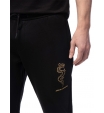 Джоггеры черного цвета с вышивкой дракона и названием бренда Armani Exchange