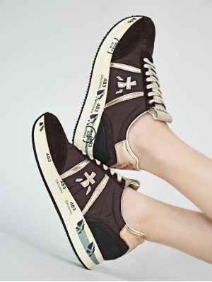 Кроссовки черного цвета с золотистыми вставками Premiata Conny 6980