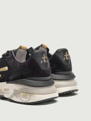 Кроссовки женские Premiata MOERUND7799, черного цвета с желтым логотипом